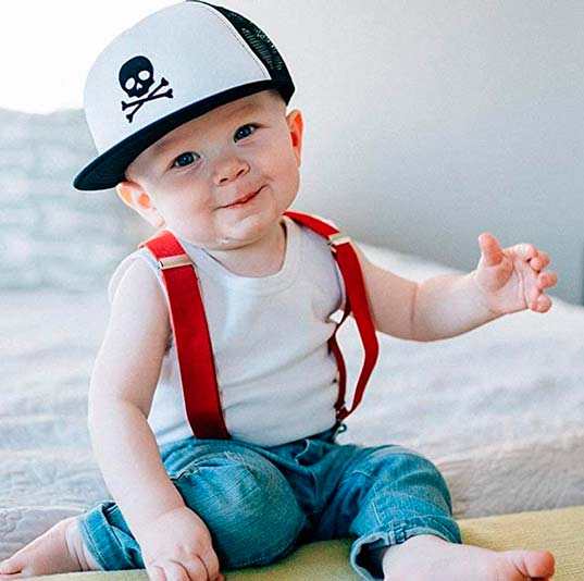 a baby using a KNUCKLEHEADS trucker cap for baby